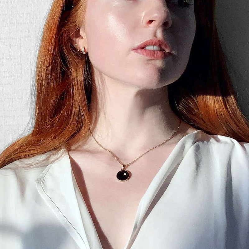 Double-sided sun necklace